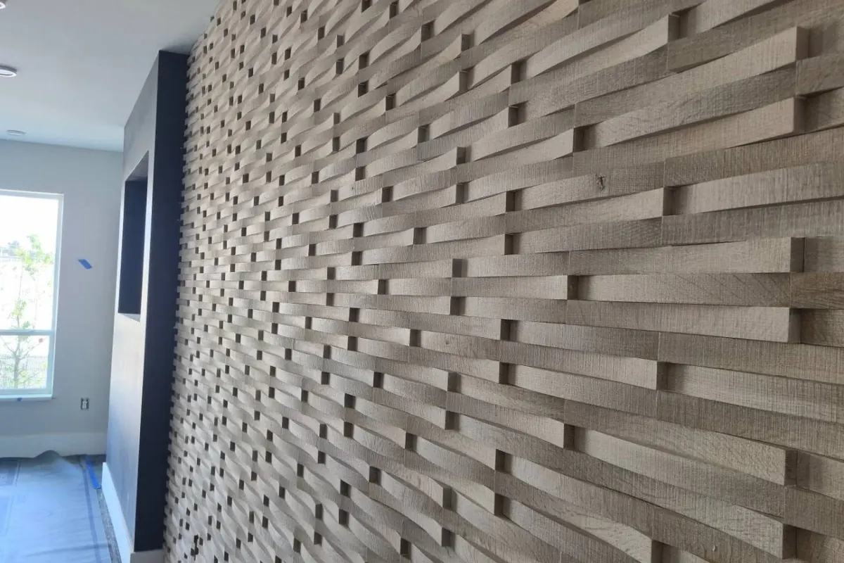 Textured 3D accent wall running the length of a room